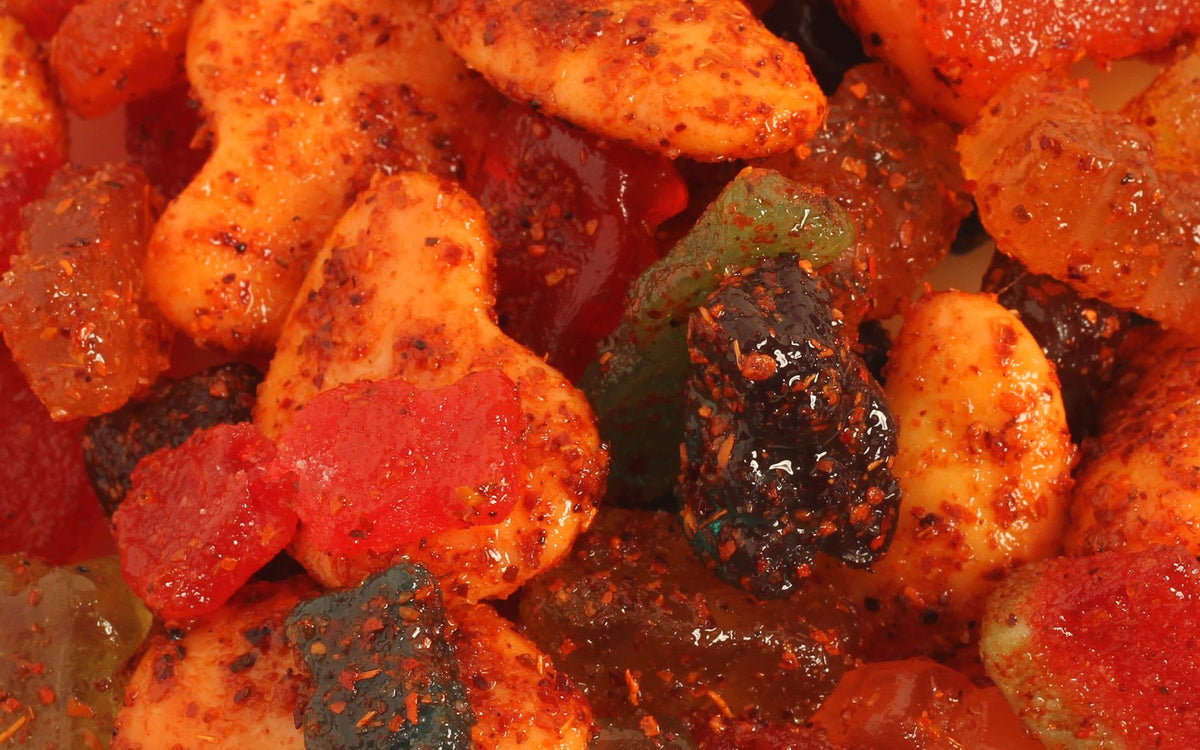 Close-up mix of chili-coated spicy chamoy gummies