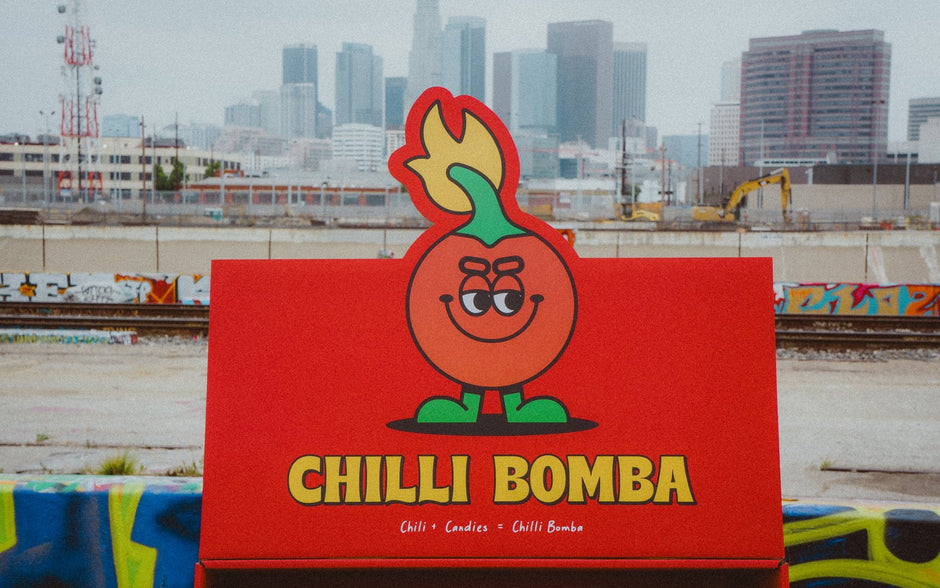 Chilli Bomba display with Mr. Bomba in front of the downtown Los Angeles skyline